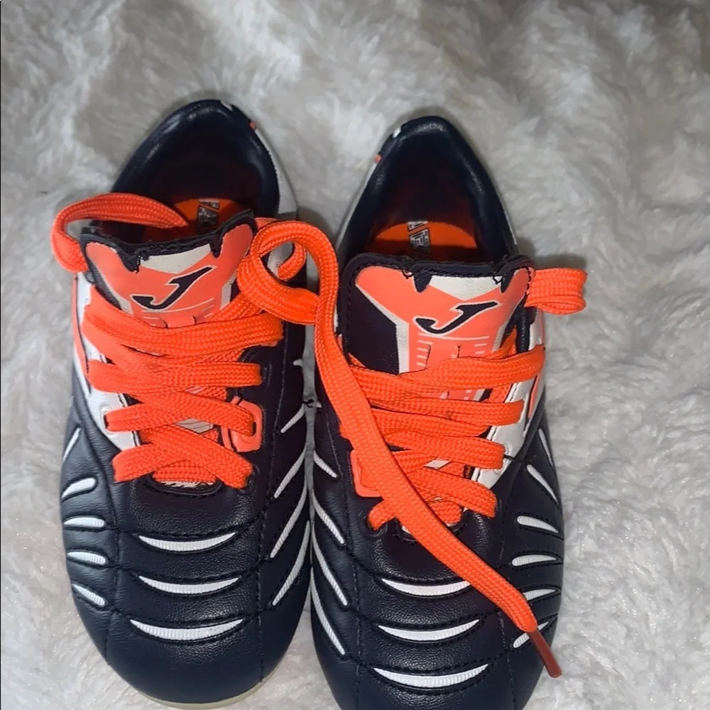 Kids Black and Orange Soccer Shoes like new